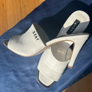 NEVER WORN! Classy, sassy white DKNY 3” heels! Love the metal toe tips. Size 10.